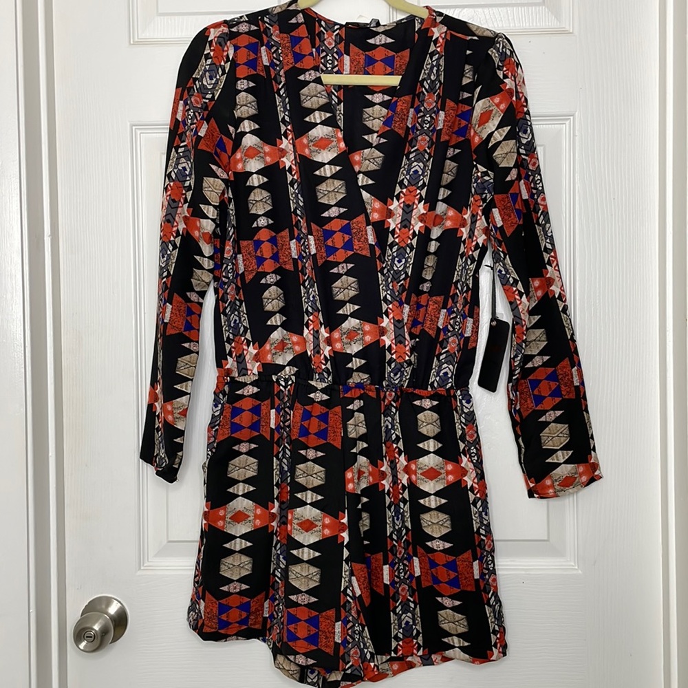 Brand new never worn . One piece, Long sleeve shorts romper with pockets.